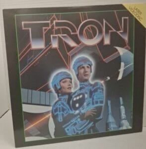 Anna Williams showcasing a Tron movie collectible for the Treasures of Giving program