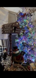 North Pole Express decorative mailbox and festive white Christmas tree at a Grasons estate sale