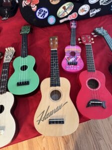 Detailed view of a wooden ukulele collectible from a Grasons Elite Orange County estate sale